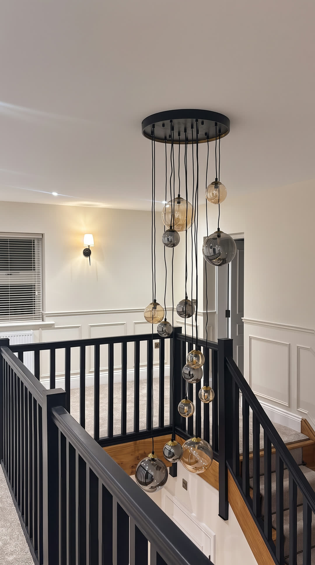 Landing with a cascade of glass pendants over the stairwell