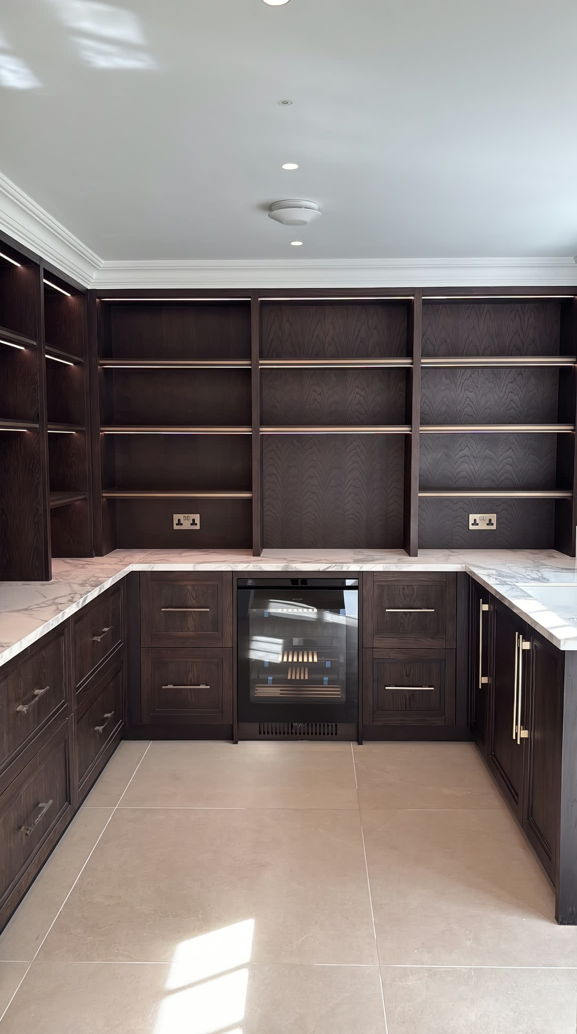 Miller House: dark oak joinery with a marble worktop