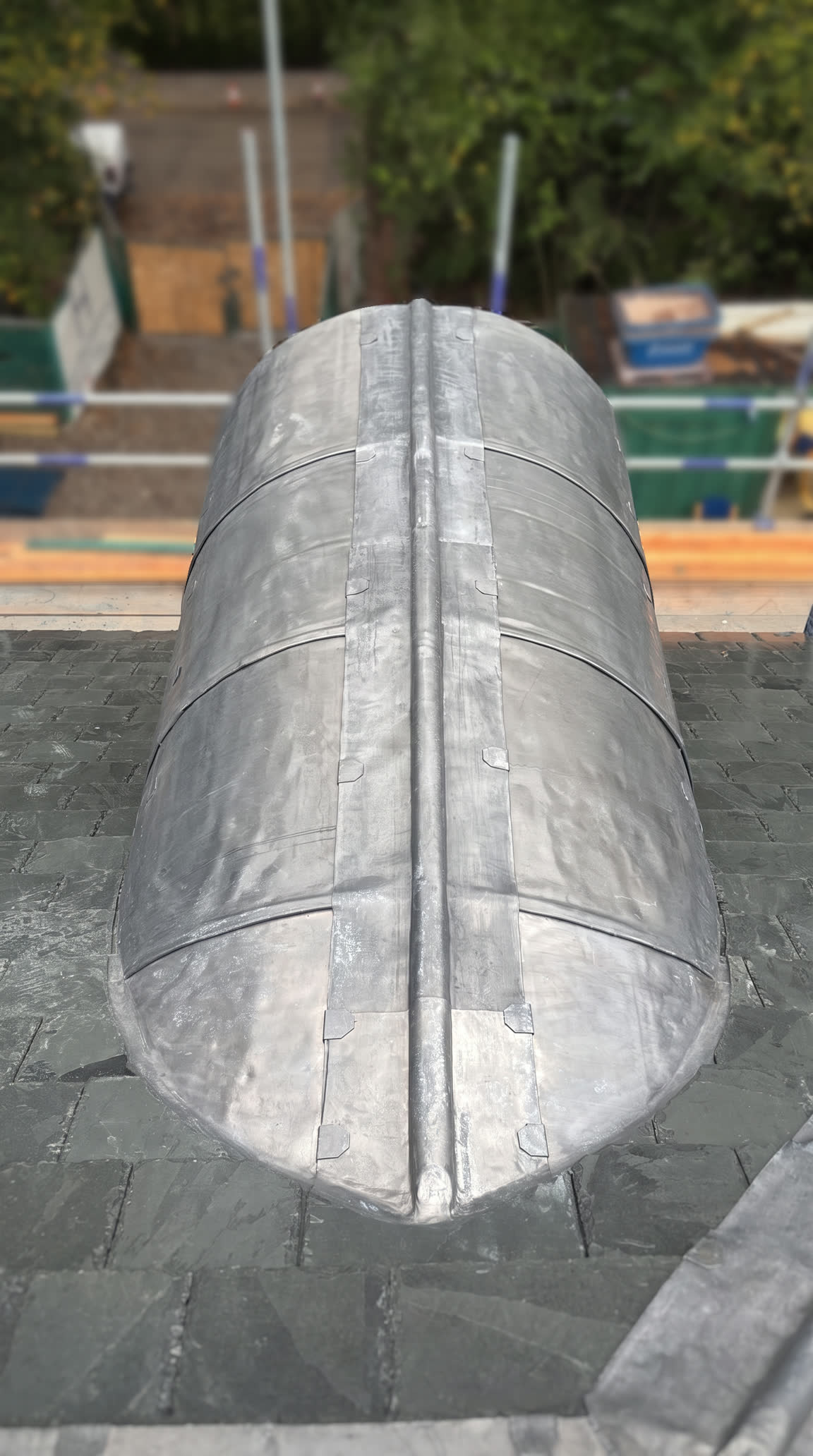 Lead-clad dormer set into the slate roof